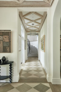 Main hallway with checkered ceilings and floors limestone